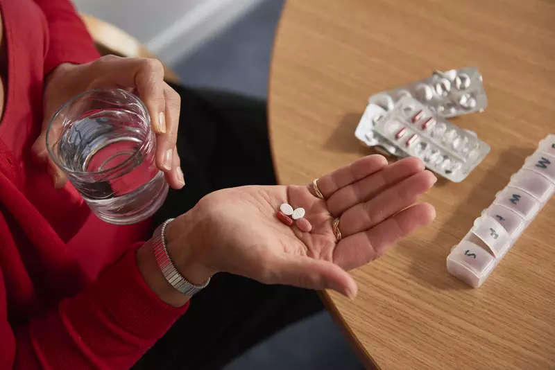 Lady taking medication