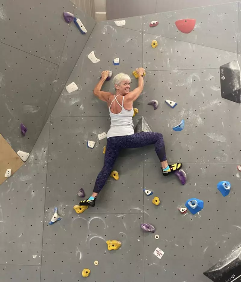 Jackie on a climbing wall